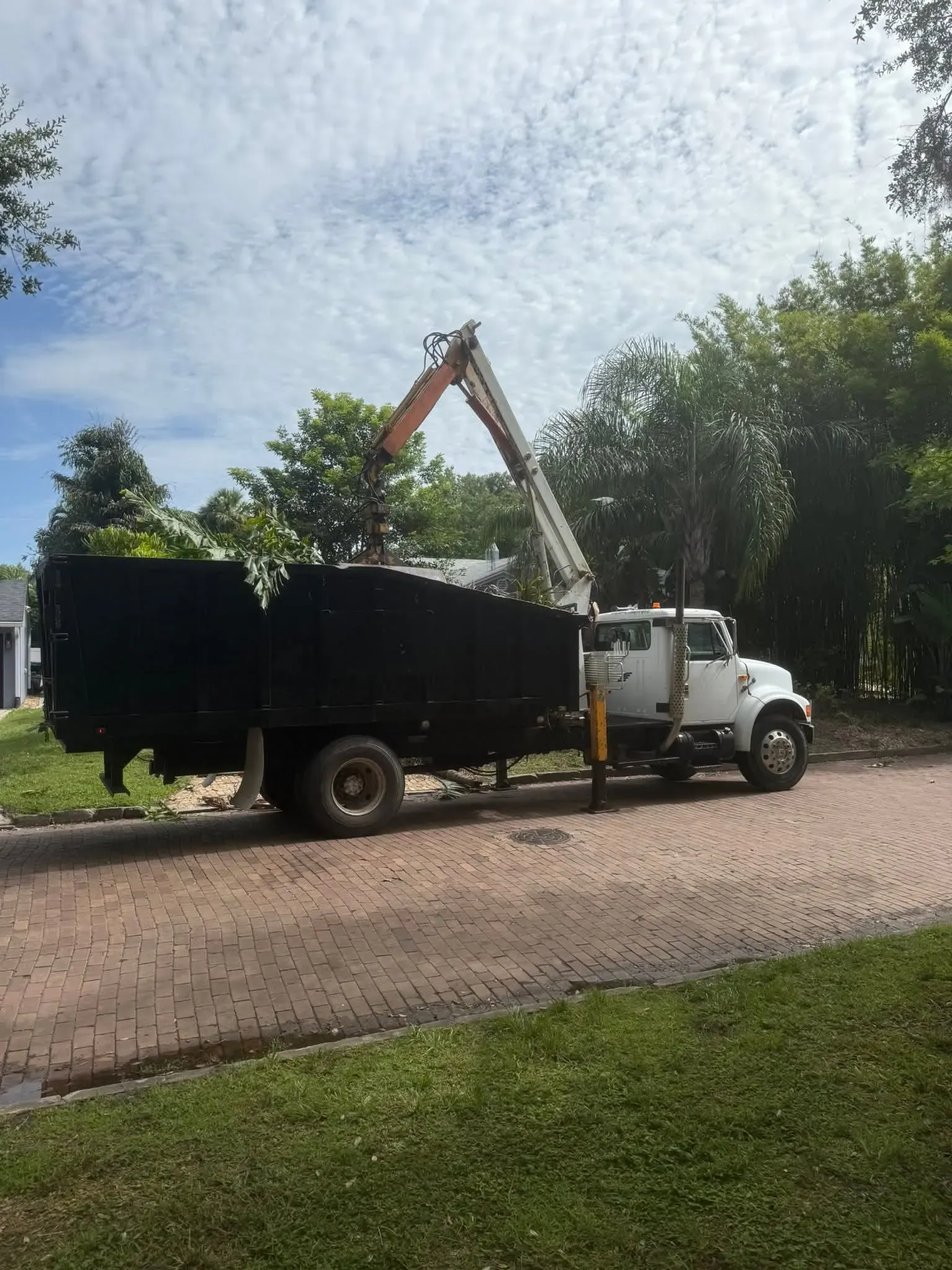 Daytona Grapple Truck Service clearing storm debris